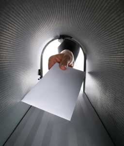 Hand reaching into mailbox